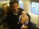 Imran Khan Picture with a Baby in PIA Flight